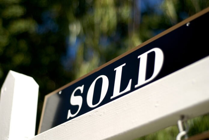Seller Financing Features sold sign in black with white lettering