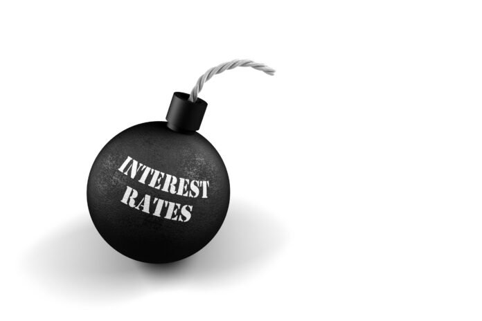 Interest Rates old fashioned round bomb with a fuse with Interest Rates written on it