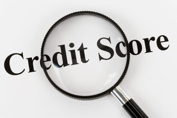 How To Qualify Borrowers: Know A+ From F Credit Rating Credit score text with a magnifying glass highlighting the words.